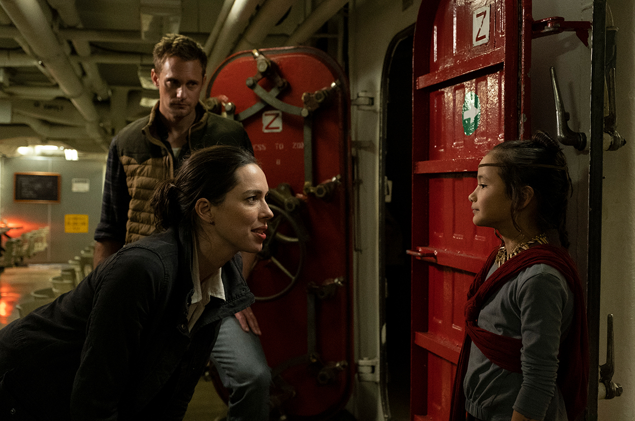 (L back-r) ALEXANDER SKARSGÅRD as Nathan Lind, REBECCA HALL as Ilene Andrews and KAYLEE HOTTLE as Jia in Warner Bros. Pictures’ and Legendary Pictures’ action adventure “GODZILLA VS. KONG,” a Warner Bros. Pictures and Legendary release.