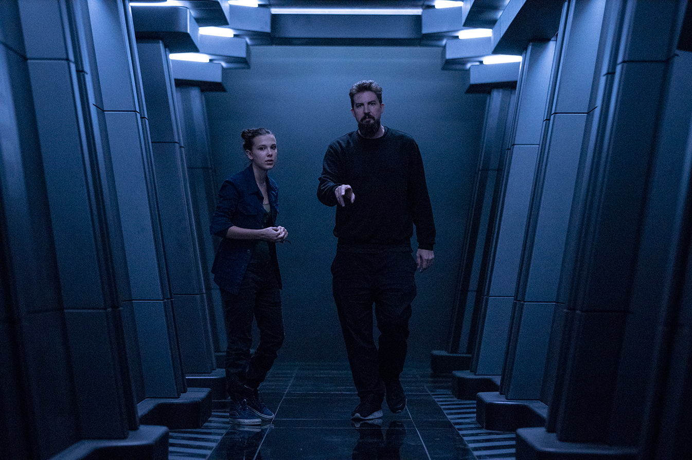 (L-r) MILLIE BOBBY BROWN and director ADAM WINGARD on the set of Warner Bros. Pictures’ and Legendary Pictures’ action adventure “GODZILLA VS. KONG,” a Warner Bros. Pictures and Legendary Pictures release.