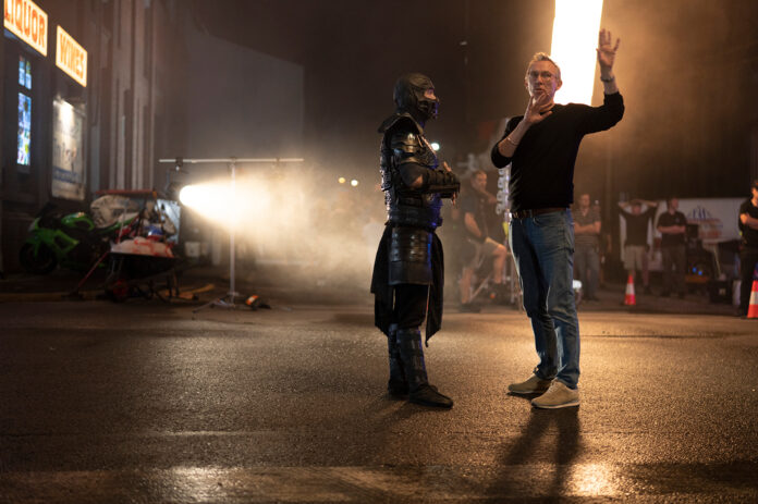 (L-r) JOE TASLIM and director/producer SIMON MCQUOID on the set of New Line Cinema’s action adventure “Mortal Kombat,” a Warner Bros. Pictures release.