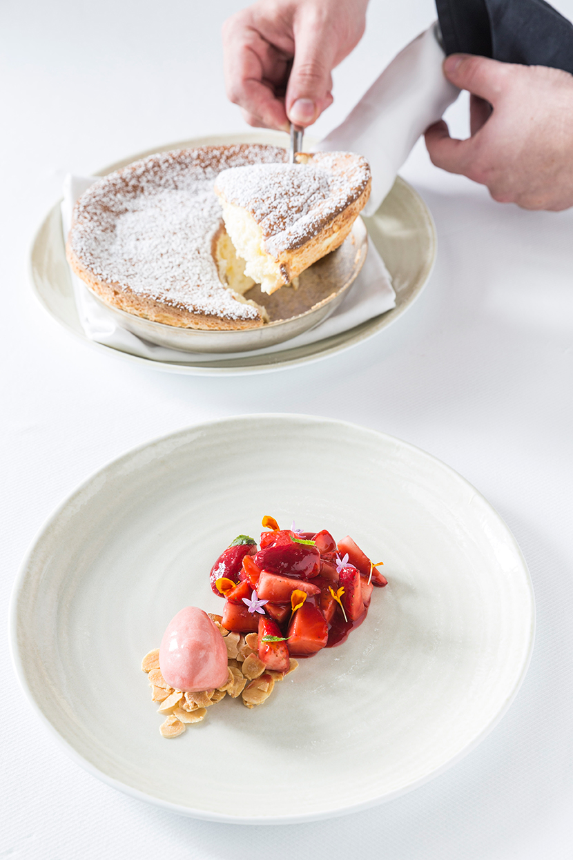 Spago Kaiserschmarrn is a light and fluffy Austrian pancake served with warm strawberries and strawberry ice cream