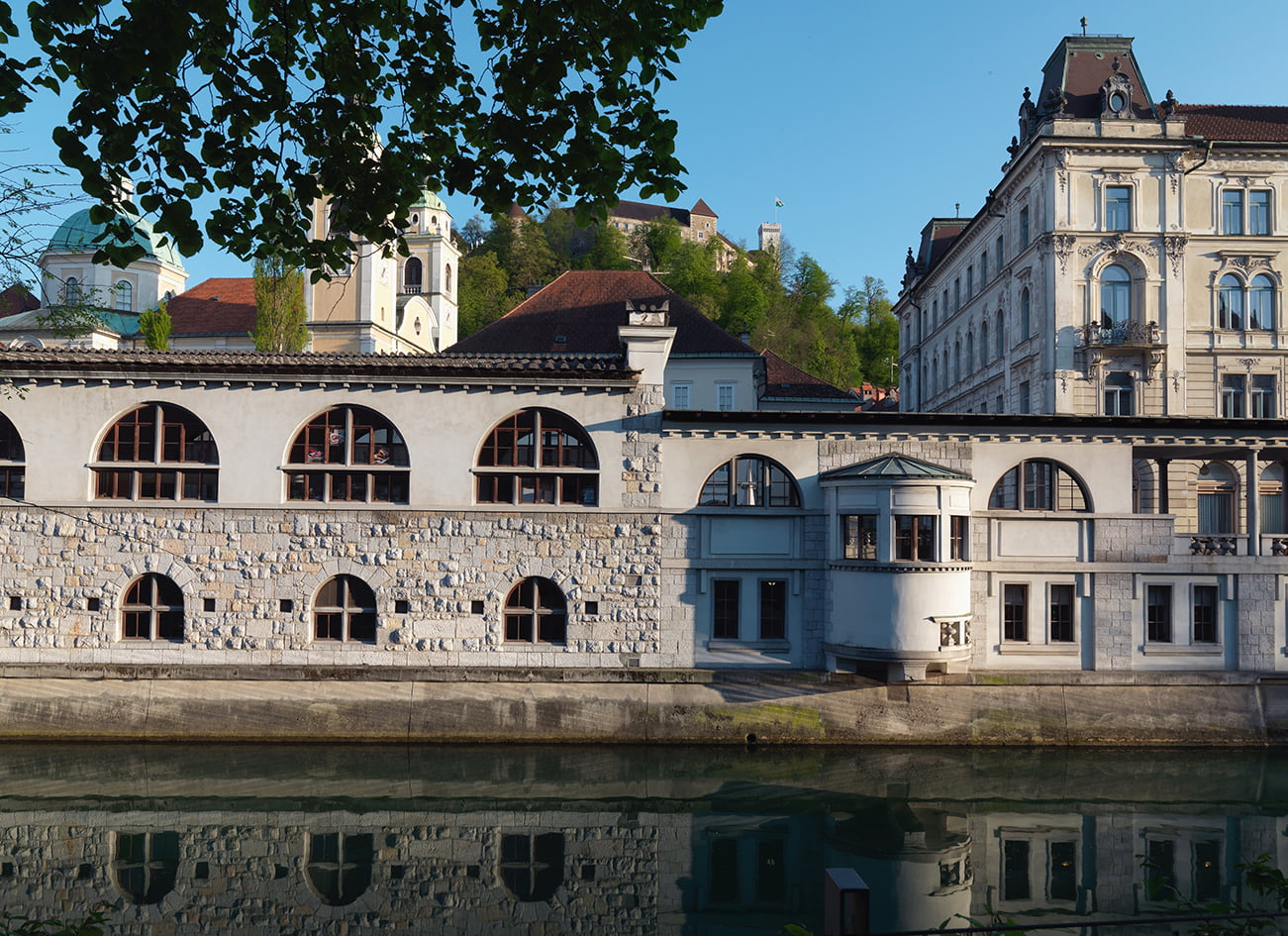 The work Jože Plečnik in Ljubljana - Human Centred Urband Design - Slovenia - View of the river side facade with a pier housing the spiral staircase