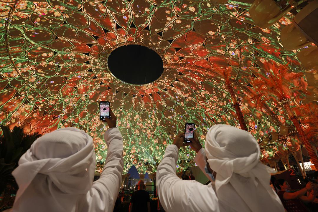 Visitors watch light projections at Al Wasl, Expo 2020 Dubai.