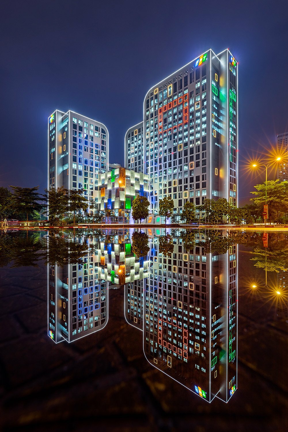 FPT Tower - Photographer Name: Khanh Le Viet - Hanoi FPT Corporation's building reflected on the street, on a rainy night.