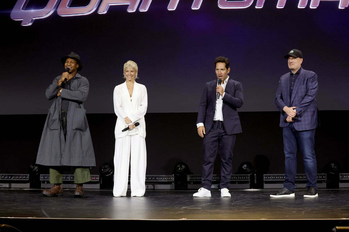 ANAHEIM, CALIFORNIA - SEPTEMBER 10: (L-R) Jonathan Majors, Evangeline Lilly, Paul Rudd, and Kevin Feige, President of Marvel Studios and Chief Creative Officer of Marvel, speaks onstage during D23 Expo 2022 at Anaheim Convention Center in Anaheim, California on September 10, 2022.