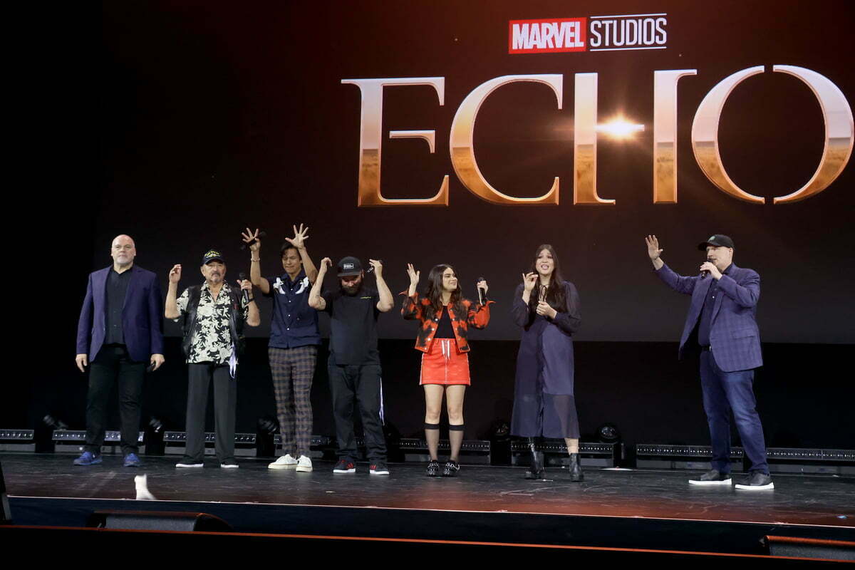 ANAHEIM, CALIFORNIA - SEPTEMBER 10: (L-R) Vincent D'Onofrio, Graham Greene, Chaske Spencer, Cody Lightning, Devery Jacobs, Alaqua Cox, and Kevin Feige, President of Marvel Studios and Chief Creative Officer of Marvel, speak onstage during D23 Expo 2022 at Anaheim Convention Center in Anaheim, California on September 10, 2022.