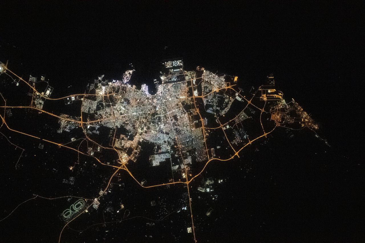 (Dec. 4, 2022) --- The city lights of Doha, Qatar, are pictured on the coast of the Persian Gulf as the International Space Station orbited 258 miles above.