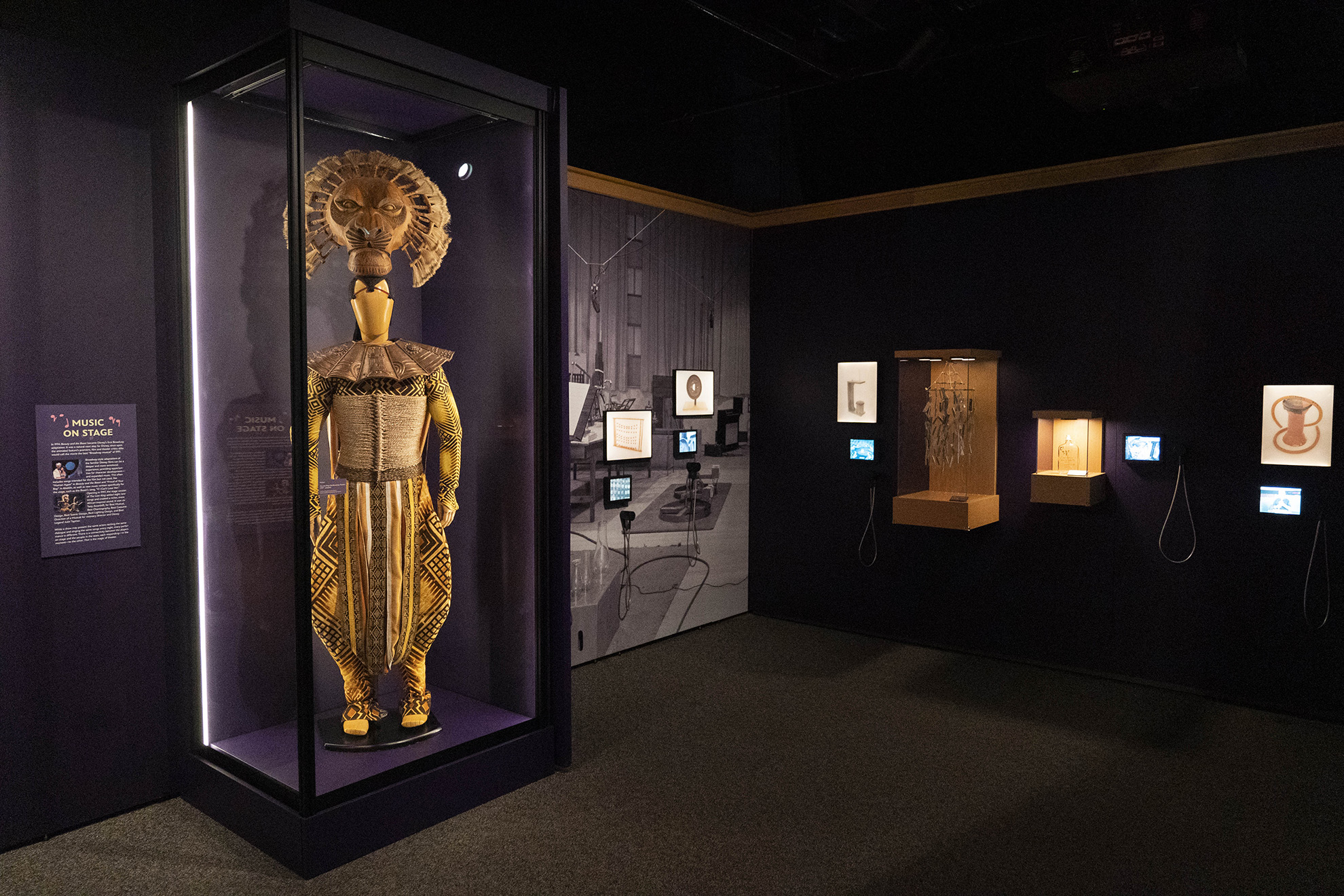 Mufasa costume from The Lion King: The Broadway Musical (1997-present) inside The Magic of Sound and Music gallery at Disney100: The Exhibition, now open at The Franklin Institute in Philadelphia. 