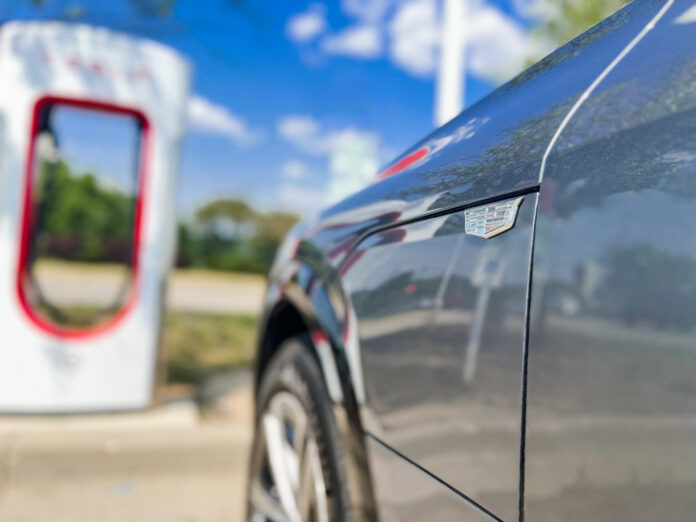 Cadillac LYRIQ at Tesla Supercharger Station