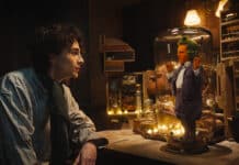 (L-r) TIMOTHÉE CHALAMET as Willy Wonka and HUGH GRANT as an Oompa Loompa in Warner Bros. Pictures and Village Roadshow Pictures’ “WONKA,” a Warner Bros. Pictures release.