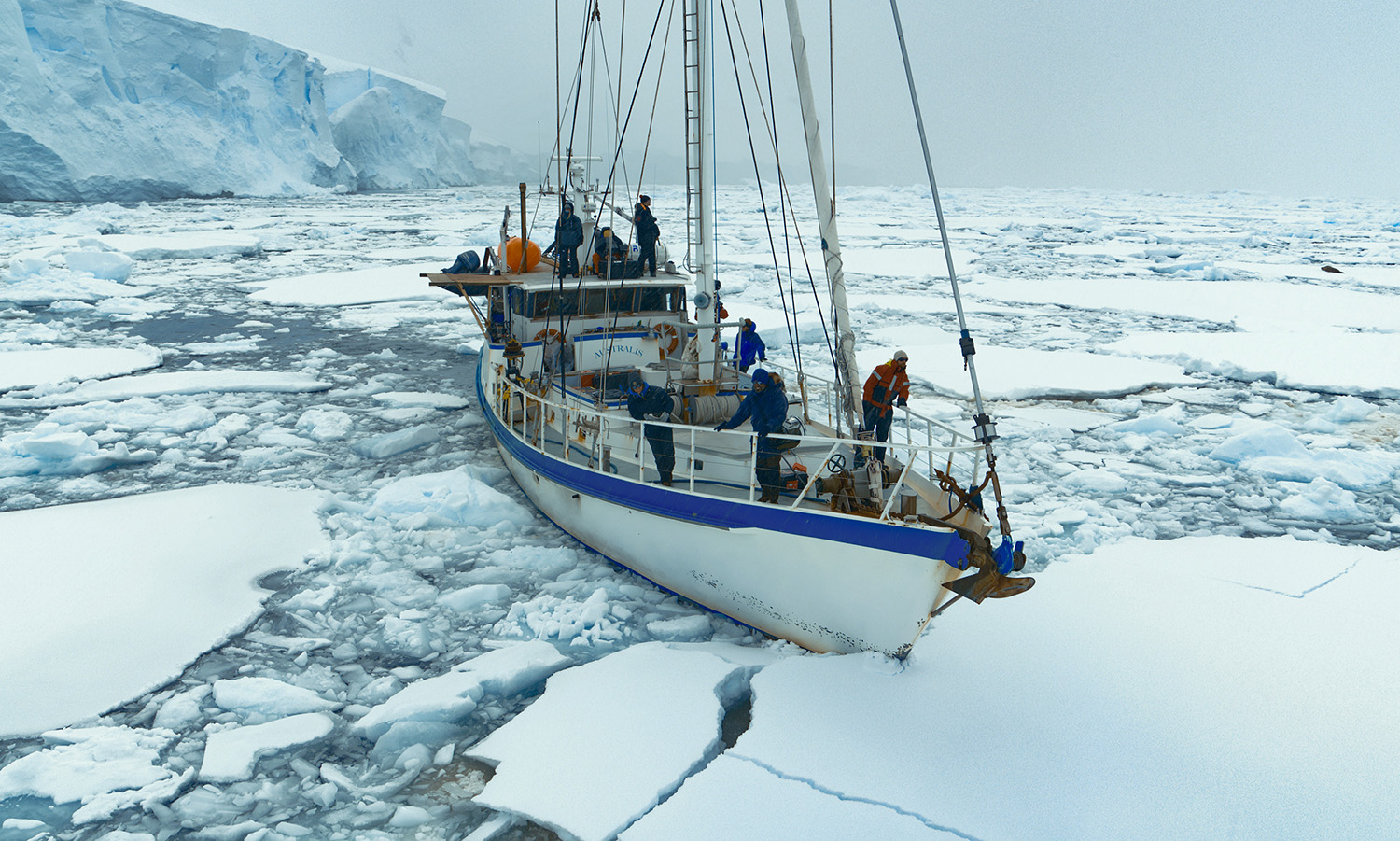 The crew onboard the Australis, heading through the ice sheets.