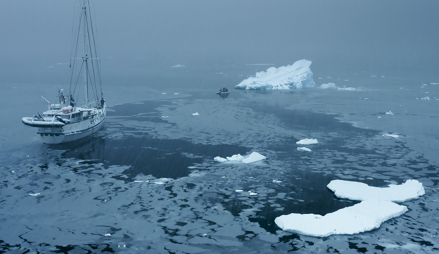 Film crew on the rib moving away from Australis and towards an iceberg.