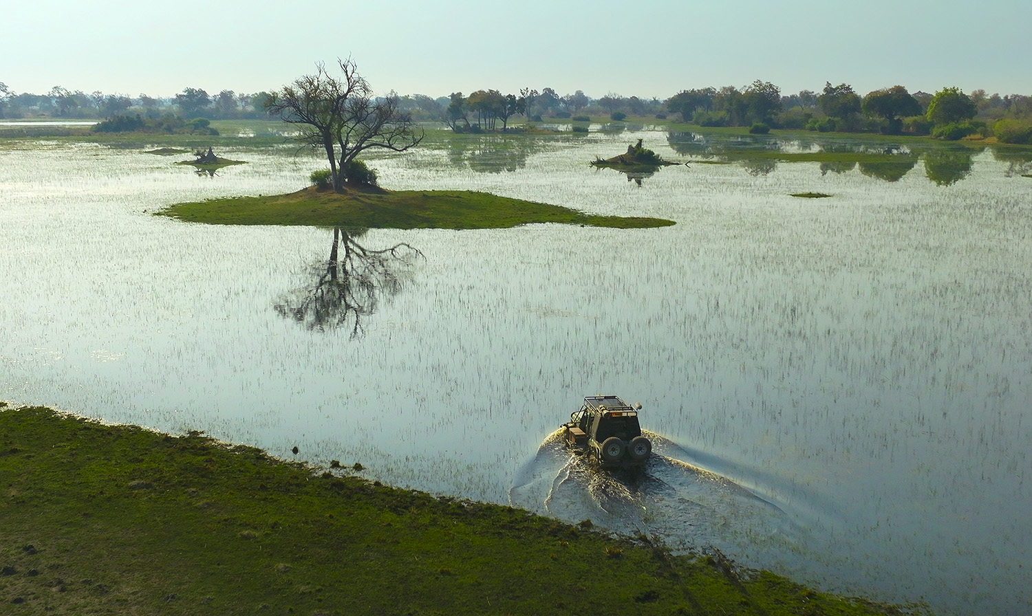 4x4 driving through the flooded plain.