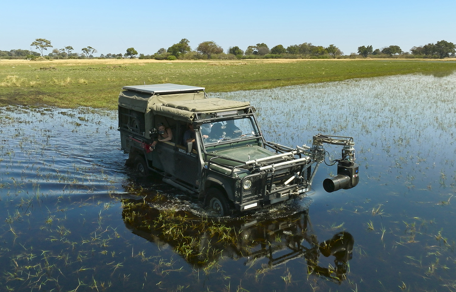 4X4 Vehicle with shotover on the front, in the water.
