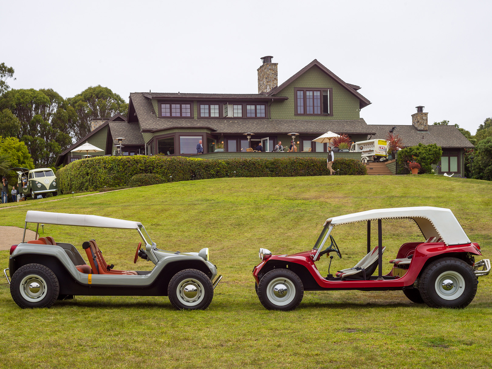 New Manx Resorter NEV (left) is modeled after and faces an original red Meyers Manx Roadster - Meyers Manx Private Gathering on August 17th at the Trousdale House in Monterey, California