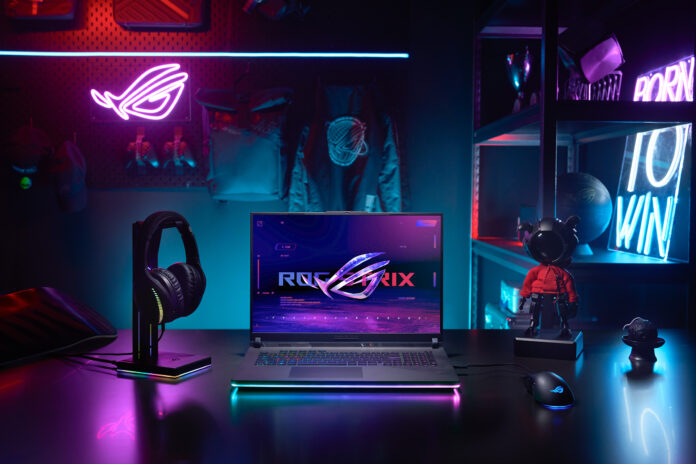 Front facing view of the Strix SCAR 18 with the ROG Fearless Eye logo visible on screen and the keyboard visible