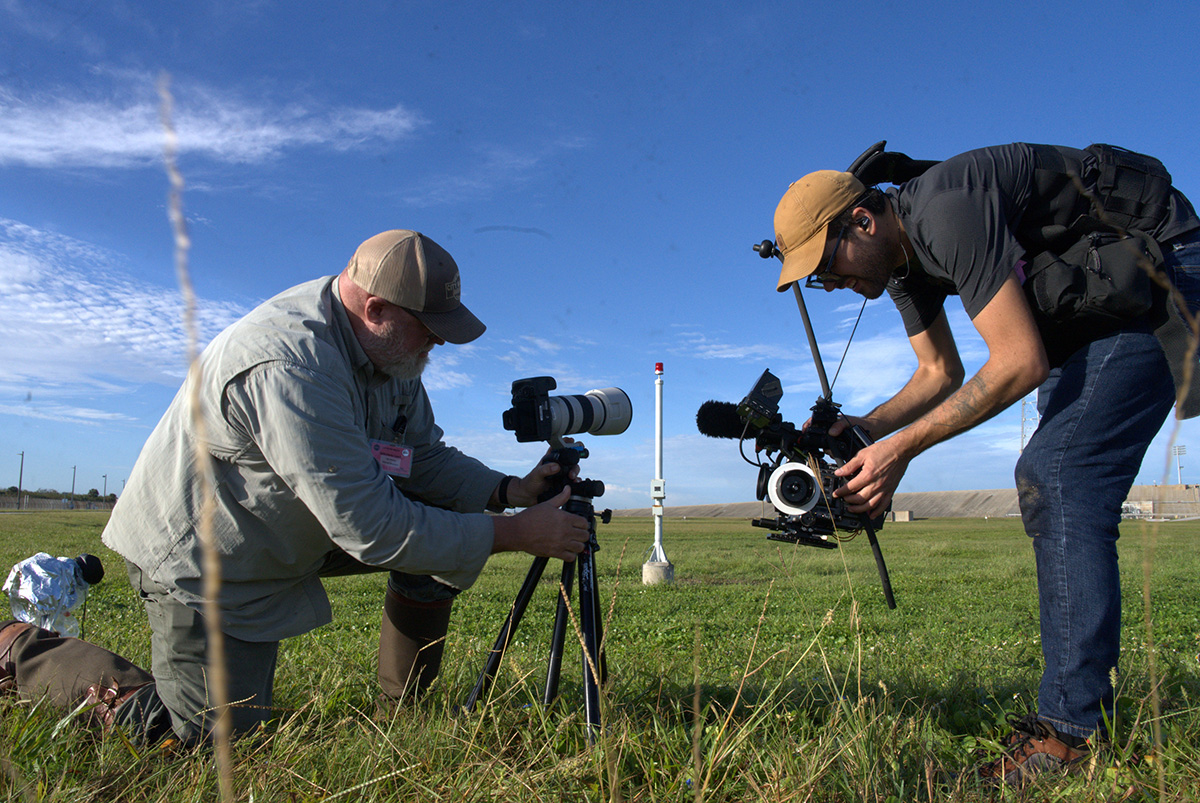 Michael Crommett (DP) films Dan Winters as he prepares to take a photograph.