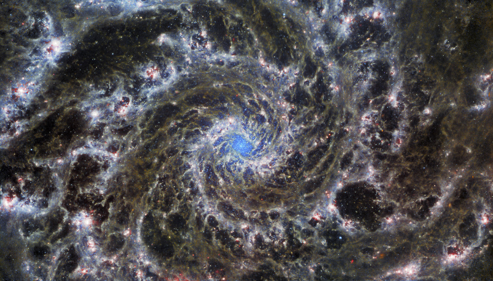 Featured in the IMAX® documentary DEEP SKY,  this image from JWST shows the heart of M74, otherwise known as the Phantom Galaxy. M74 is a particular class of spiral galaxy known as a ‘grand design spiral’, meaning that its spiral arms are prominent and well-defined, unlike the patchy and ragged structure seen in some spiral galaxies.