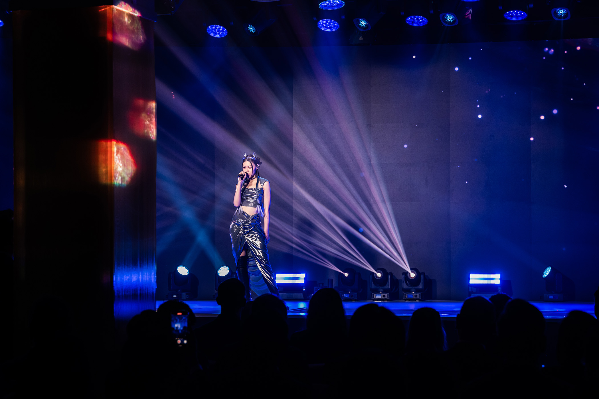 Singaporean singer-songwriter Jasmine Sokko performing at the groundbreaking ceremony