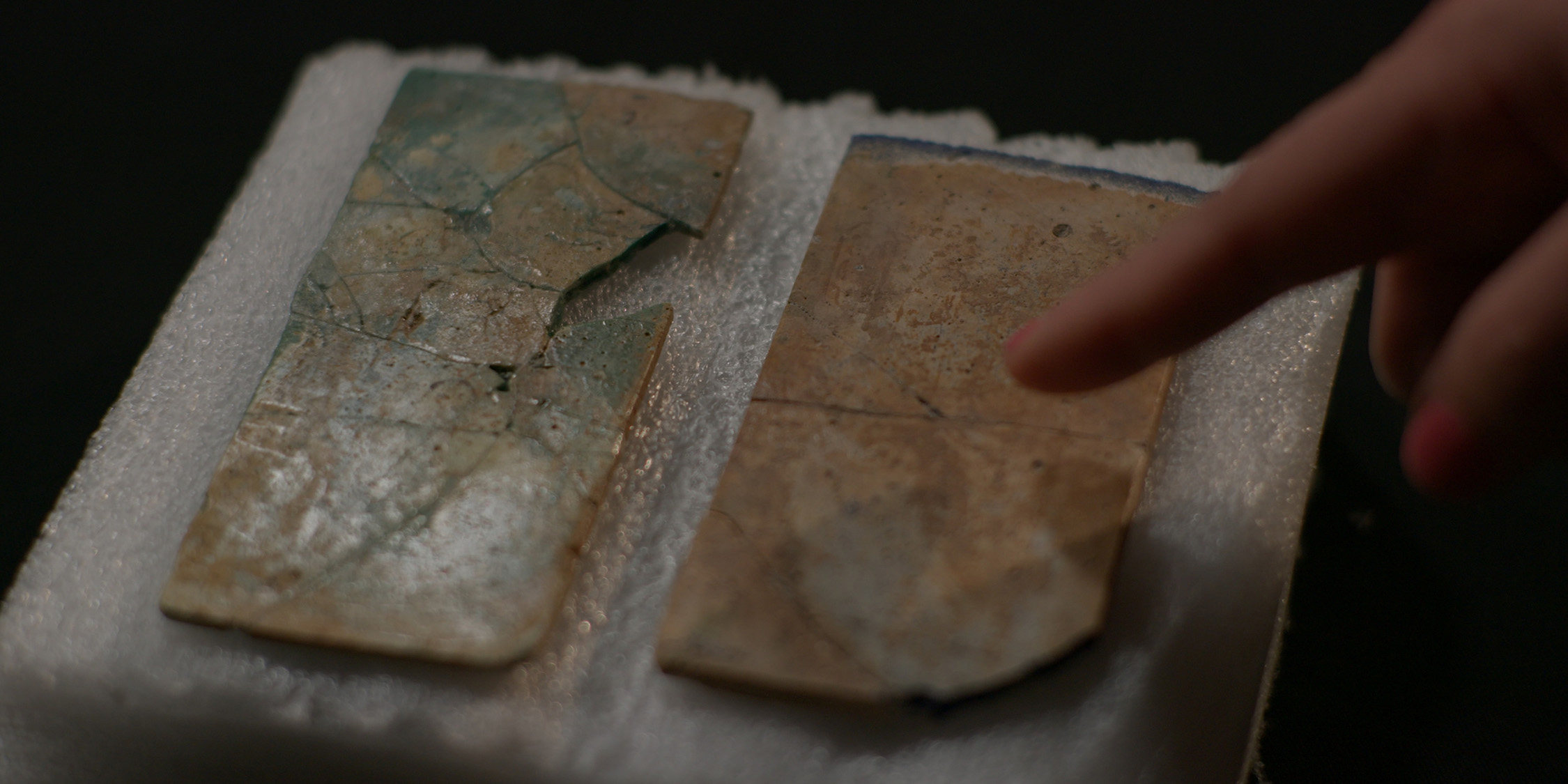 Kathleen Martinez finger points to two relics in the Greco-Roman Museum.