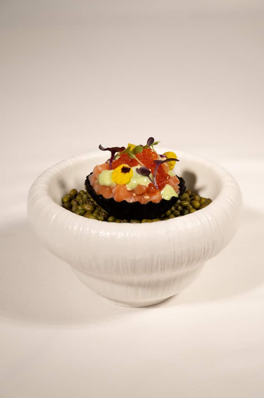 THE FIRST IMPRESSION-Nori Tart with salmon belly tartare, salmon roe, gherkin, shallot, sesame, ginger, and wasabi mayonnaise - The Anam Mui Ne